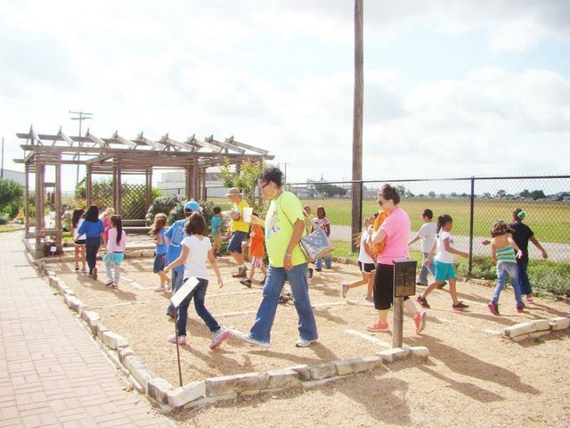School Group visits and enjoys labyrinth