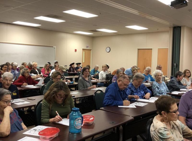 Attendees take notes at previous Lunch and Learn