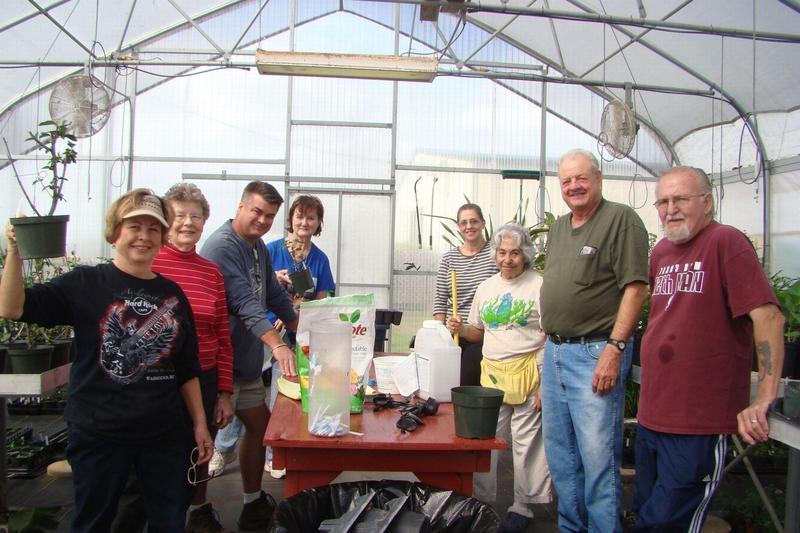Master Gardeners work many hours in the greenhouse